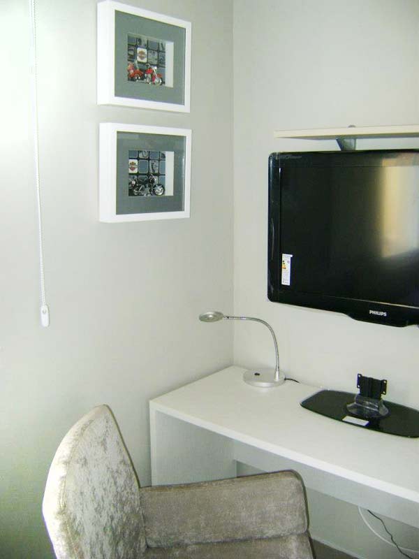 Canto da TV de um apartamento de 67 m². Projetado por Liane Martins.