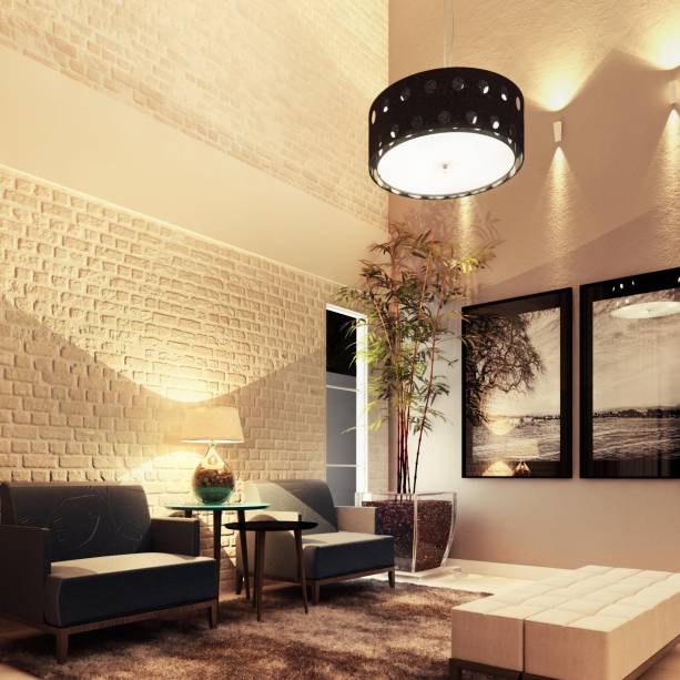 Neste living, uma massa feita a mão, a base de pó de pedra e resina, dá o efeito de tijolos aparentes. Uma pintura pátina com caramelo e branco completa a parede. O espaço de 20 m² é assinado pelo designer de interiores Fernando Septimus.