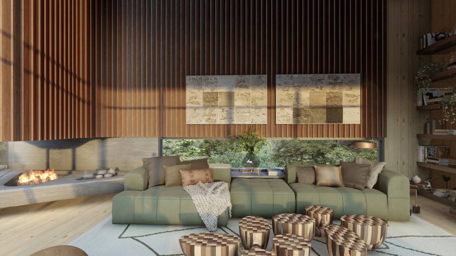 Sala de Estar, por Maurício Magarão | A primeira providência foi ampliar a integração dos dois ambientes, removendo uma parede e trocando-a por vidro, criando um ângulo mais aberto, dialogando com a geometria do teto e conduzindo o olhar para a incrível vista. A partir daí, moldaram uma grande bancada em pedra natural (Lucerna), da Harmony Stones, e incluíram ali peças decorativas, um grande futon e a lareira.