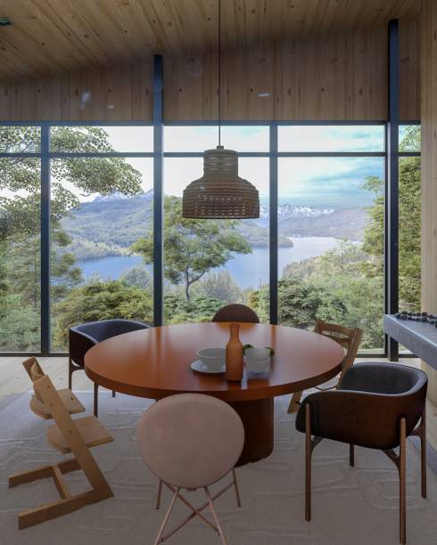 Sala de Jantar, por Isabela Fraia Arquitetura | São obras de diferentes texturas e técnicas artísticas, que ganham destaque ao lado de uma grande estante tingida de verde musgo, recheada de uma coleção de cerâmicas e vasos que trazem a vegetação local.