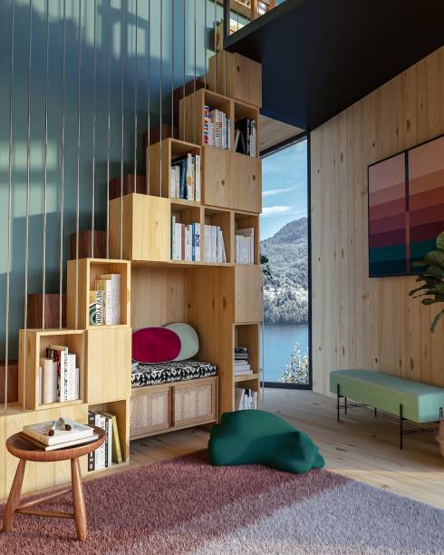 Sala de Leitura, por Marcella Reynol Arquitetura | Aproveitou o pé direito duplo e propôs, ali, um espaço para a família se esparramar na cama (Muskinha) com um bom romance em mãos. A escada (em estilo Santos Dumont) encaixa uma estante para livros na lateral em meio a objetos afetivos. A escolha de cabos de aço como guarda-corpo deixou o projeto mais leve, sem barrar a entrada de luz e a vista.