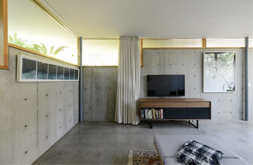 10 salas que usam concreto de forma escultural