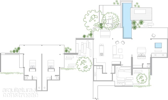 No corpo principal da construção, um painel deslizante separa sala e cozinha de uma grande suíte e seu pátio particular. Dois outros quartos ocupam a ponta oposta da planta.