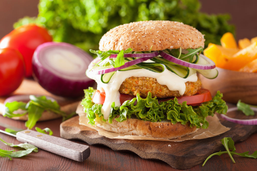 veggie carrot and oats burger with cucumber onion tomato