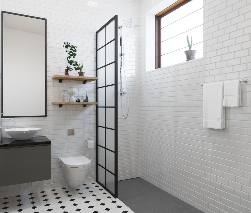Banheiro minimalista com box de vidro e tons neutros
