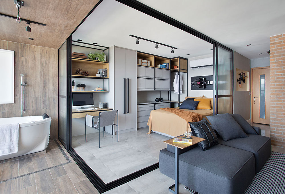 Apartamento tipo loft com 45m2 assinado pela J1 ARQUITETURA E ENGENHARIA _ foto 12-living-integrado-sala-sofa Quarto integrado ao living. Portas deslizantes em vidro isolando o cômodo