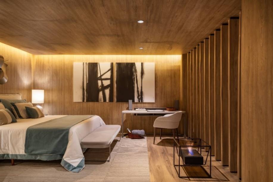 No quarto assinado por Rogério Perez e Eleonora Perez para a Mostra B&C, a lareira ecológica Eco 52, da Ecofireplaces (@ecofireplaces), deixa o ambiente ainda mais acolhedor No quarto assinado por Rogério Perez e Eleonora Perez para a Mostra B&C, a lareira ecológica Eco 52, da Ecofireplaces (@ecofireplaces), deixa o ambiente ainda mais acolhedor