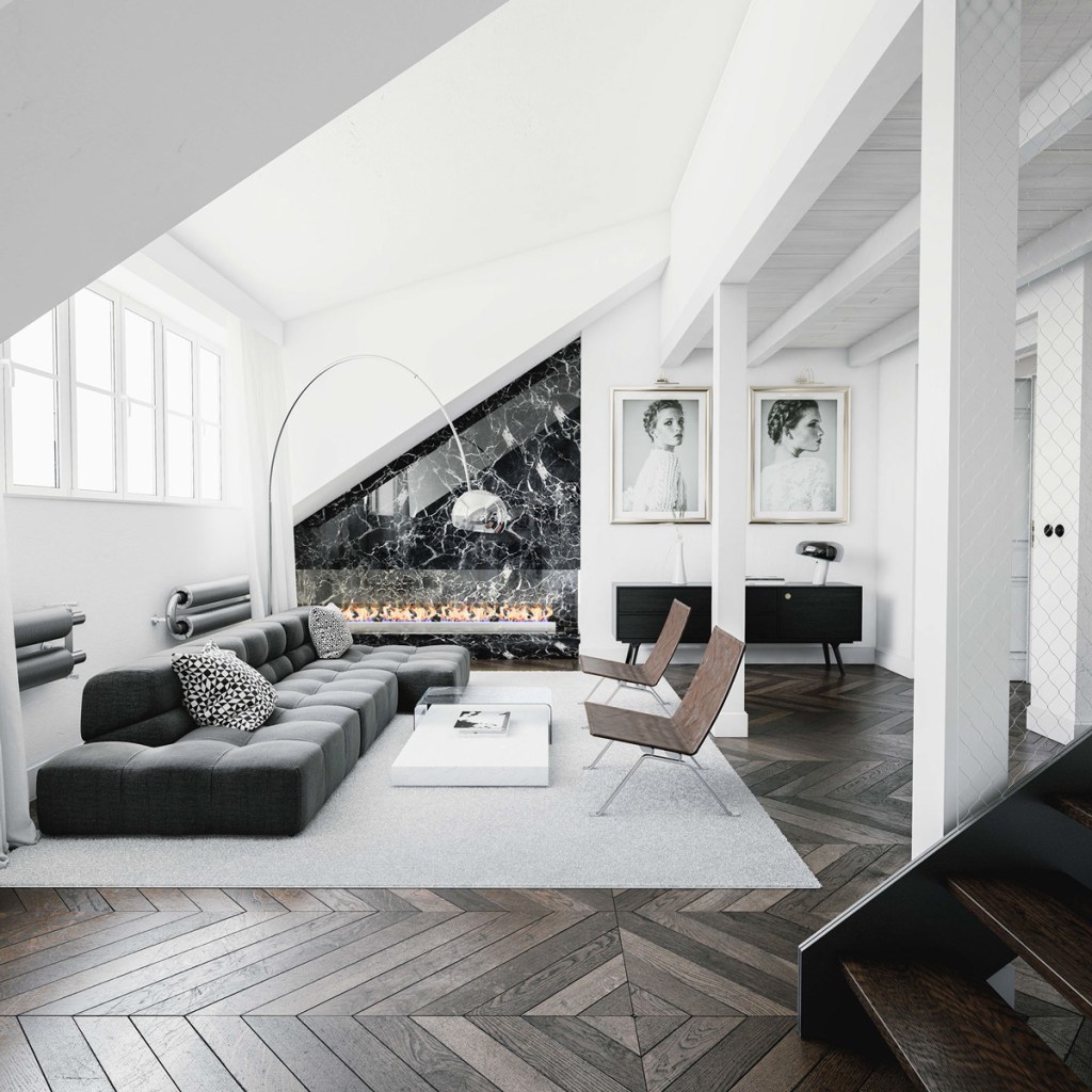 Sala com sofá preto baixo; tapete cinza; piso em taco; paredes e pilar brancos