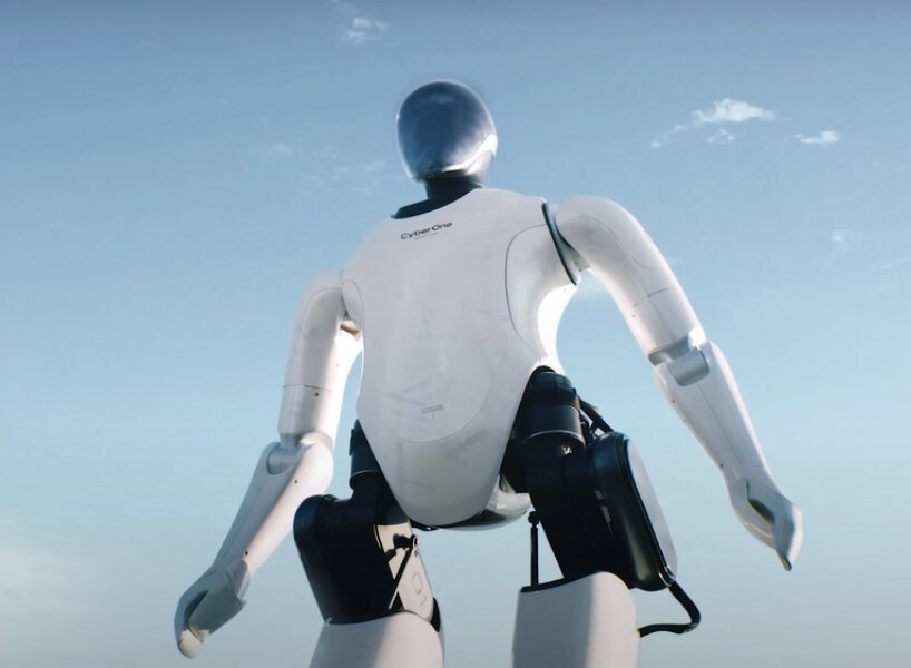 Robô humanoide com carcaça em preto e branco.