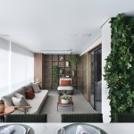 Varanda de estar gourmet é destaque em apartamento de 204 m²