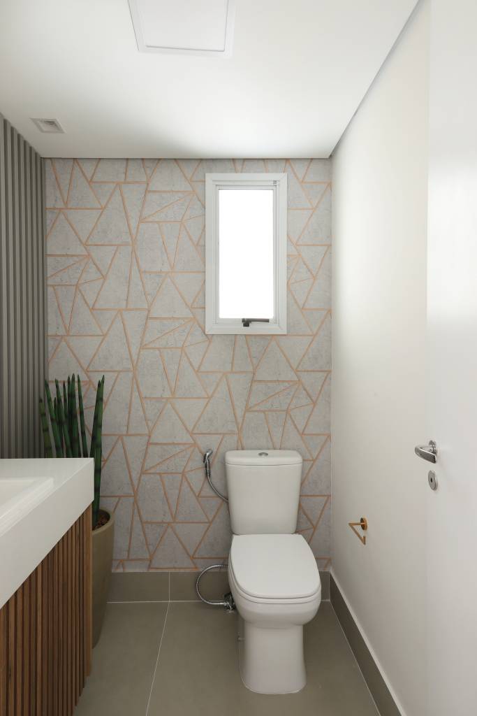 Armários em laca azul se destacam na cozinha deste apartamento. Projeto de RMV Interiores. Na foto, lavabo com vaso de planta no chão.